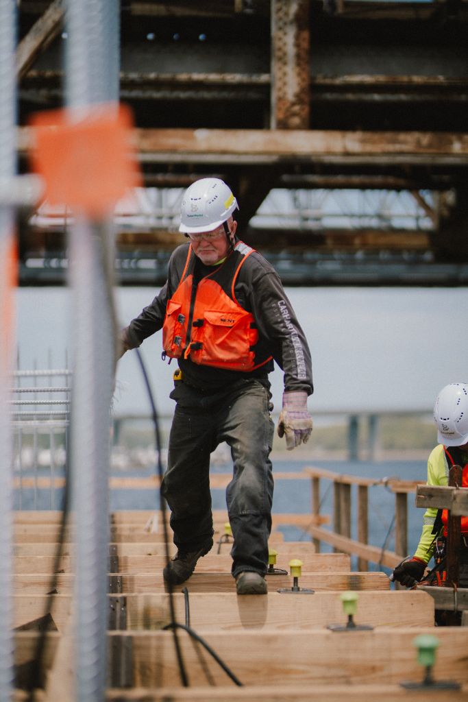 Worker navigating platform at CRB project